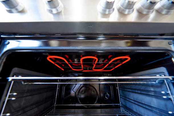 istock Empty hot oven with a flaming grill close-up. 1225740467