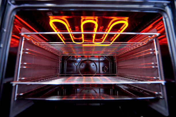 istock Empty hot oven with a flaming grill close-up. 1225740606