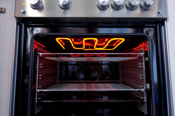 istock Empty hot oven with a flaming grill close-up. 1225740623