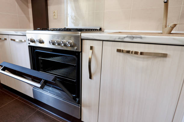istock Open oven in an empty kitchen in an apartment. 1225740663
