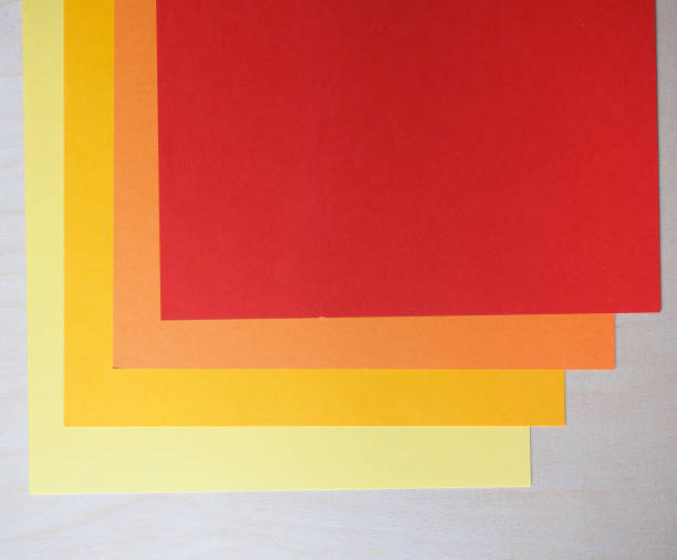 istock red orange and yellow paper texture background 1225742334