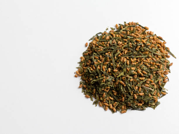 istock dried tea leaves on a white background. 1225743318