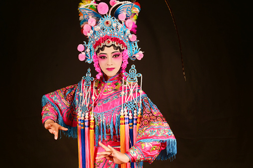 one peking opera actress performing on stage