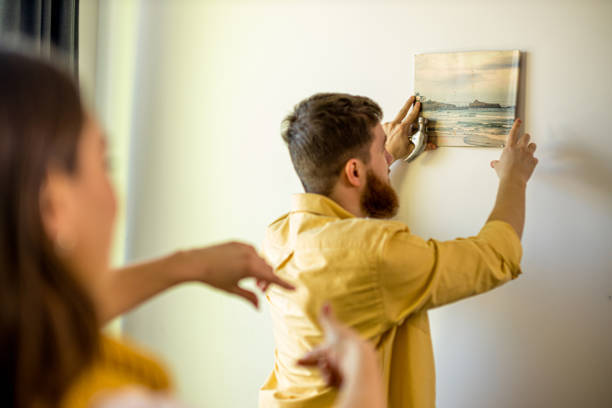 istock couple decorating their new apartment 1225744662