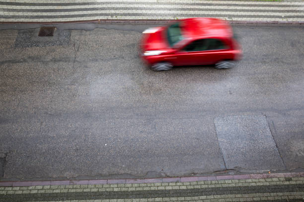 istock red car in street 1225744668