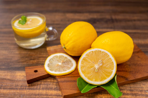 istock Fresh lemonade drinking with herb in glass, lime or mojito cocktail with lemon on wood table for copy space   in hot summer 1225745367