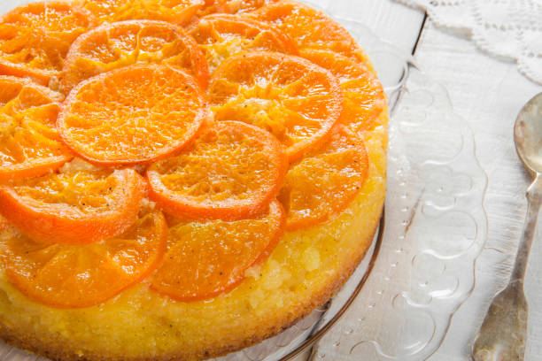 istock Homemade mandarin cake on a wooden table. 1225746231