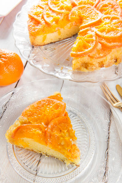 istock Homemade mandarin cake on a wooden table. 1225746232