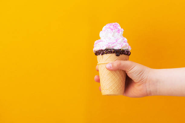 istock Child boy hand holding waffle ice cream 1225746354