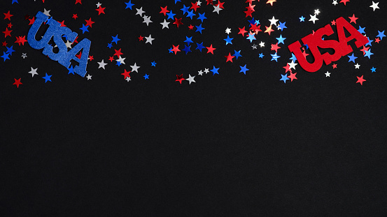 Frame border blue red white confetti and USA decorations on dark background. Happy Independence DAY USA, 4t of July celebration concept.