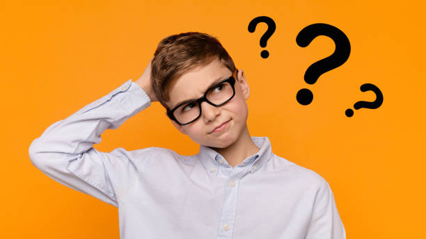 istock Pensive teenager scratching his head with doubtful expression 1225747738