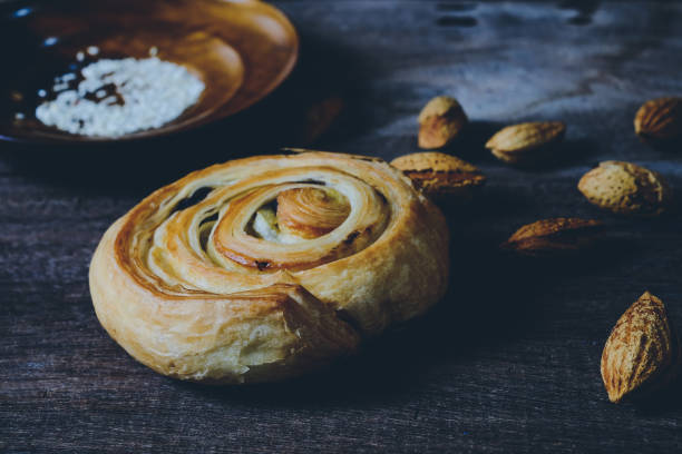 istock Bread Denis with Chocolate chips with almond on wood background. 1225747836