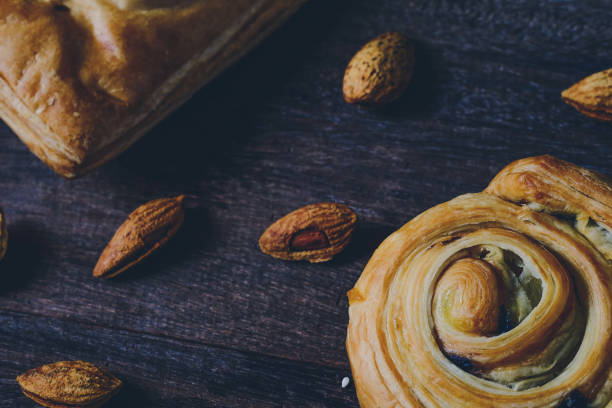 istock Bread Denis with Chocolate chips with almond on wood background. 1225747838
