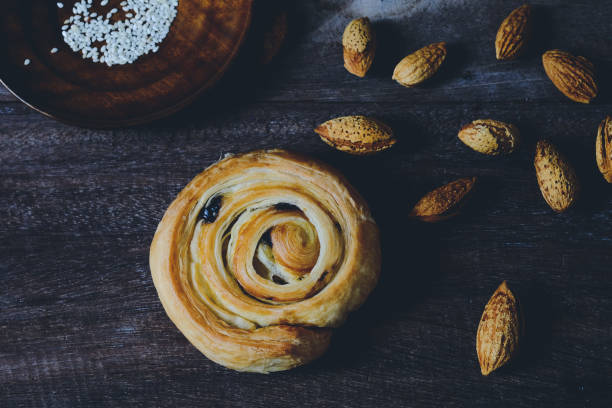 istock Bread Denis with Chocolate chips with almond on wood background. 1225747847