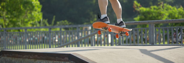 istock Skateboarder legs skateboarding on skatepark 1225750818