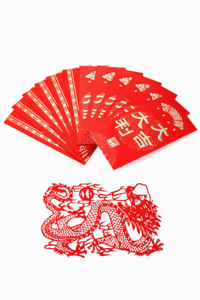 istock Red Packets Arranged Above Traditional Chinese Red Paper Cutting 1225752709