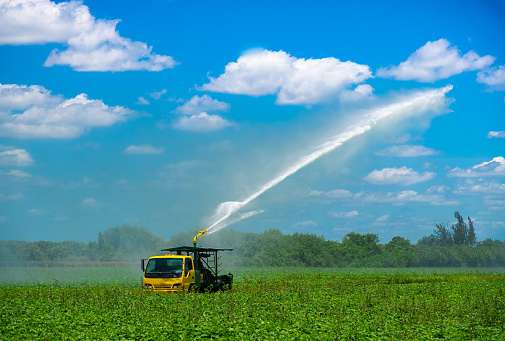 Truck watering fields of plants in Homestead Florida