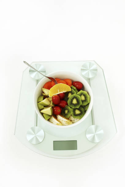 istock A Bowl Of Fruit And Vegetable Salad On Weight Scale 1225753066