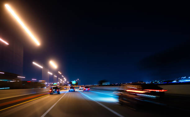 istock Blurry cars at night on highway Miami 1225753994