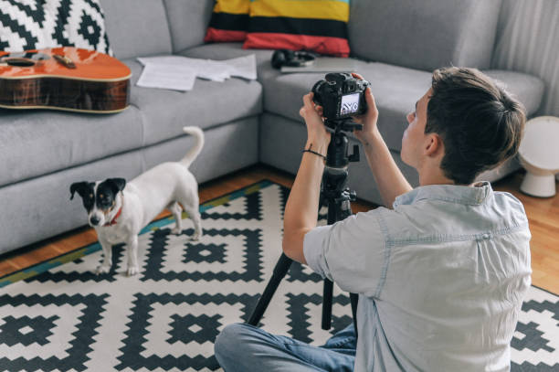 istock Young man playing guitar for his YouTube channel 1225754793