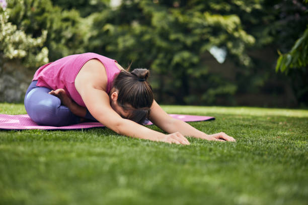 istock Woman doing yoga in her backyard. 1225756518