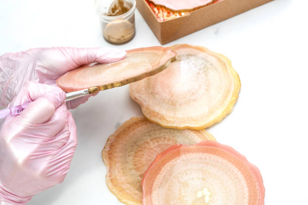 istock Creativity and craft. A young girl creates coasters from resin. Gift wrapping. Decorative packaging. Idea for business. Remote work, work at home. Art coasters. 1225757993