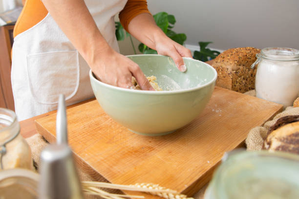 istock Skilled cook in apron kneading dough for tasty pastry and bread 1225759439