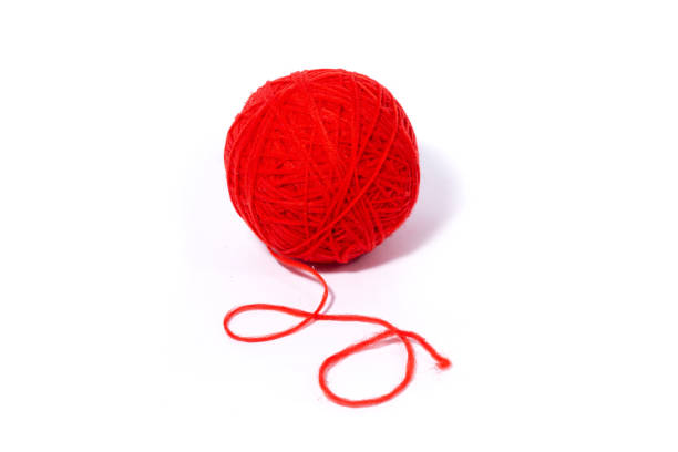 istock red ball of woolen thread,  Isolated on a white background. 1225759778