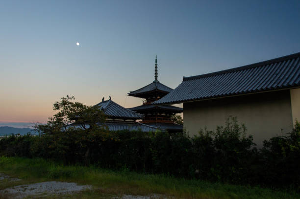 istock Rural dusk, temples and moon 1225760300