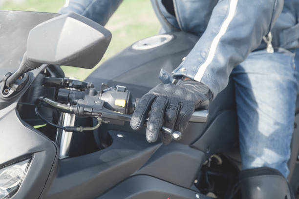 istock Caucasian motorcyclist with a black glove. Transport 1225761052