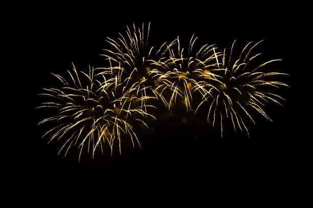istock Beautiful golden firework isolated closeup on black background 1225761115
