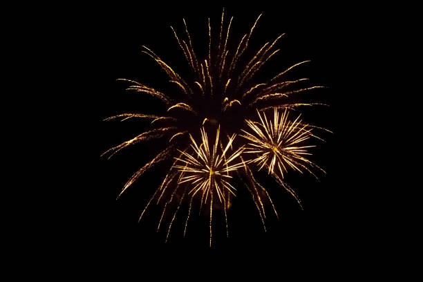 istock Beautiful yellow firework isolated closeup on black background 1225761153