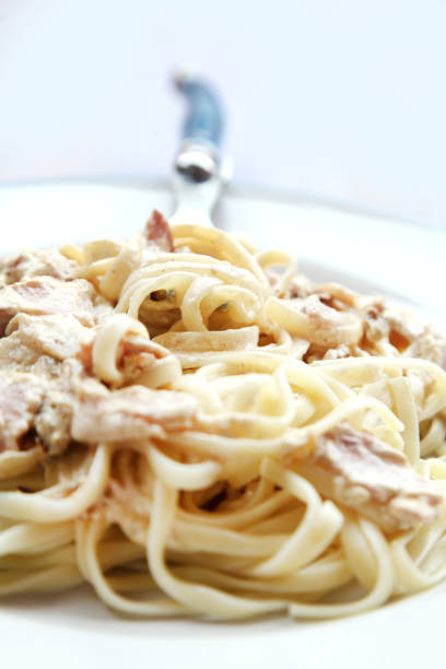 istock Plate of spaghetti with carbonara sauce 1225762597