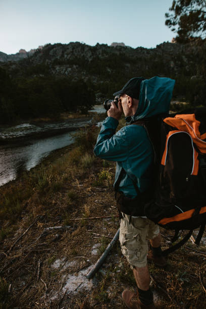 istock Hiker photographing scenic view 1225763154