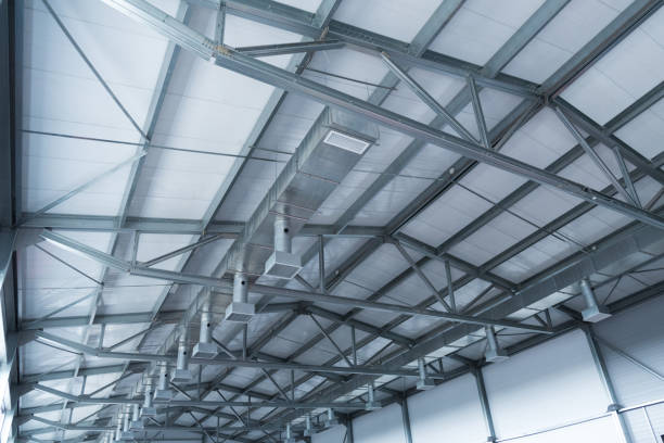 istock Ceiling installation at a manufacturing plant. Metal construction, details. Ventilation and lighting. 1225763194