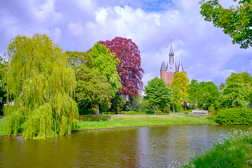 View on the Sassenpoort in the city of Zwolle, Overijssel, The Netherlands during a beautiful springtime day with clouds in the background.