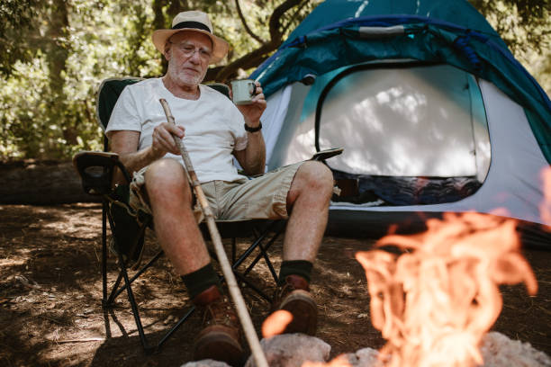 istock Senior having leisure time at campsite 1225764564