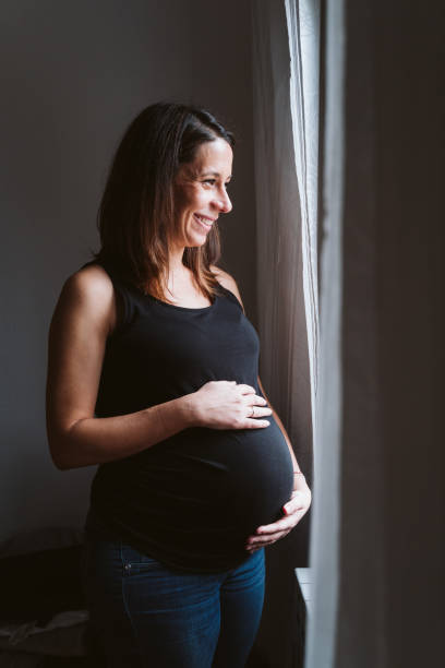 istock young pregnant woman at home 1225766112