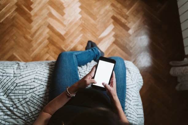 istock young pregnant woman at home using mobile phone. top view 1225766143