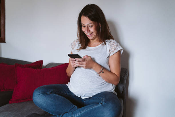 istock young pregnant woman at home using mobile phone 1225766149