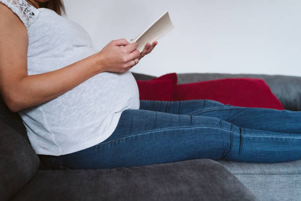 istock young pregnant woman at home reading a book 1225766157