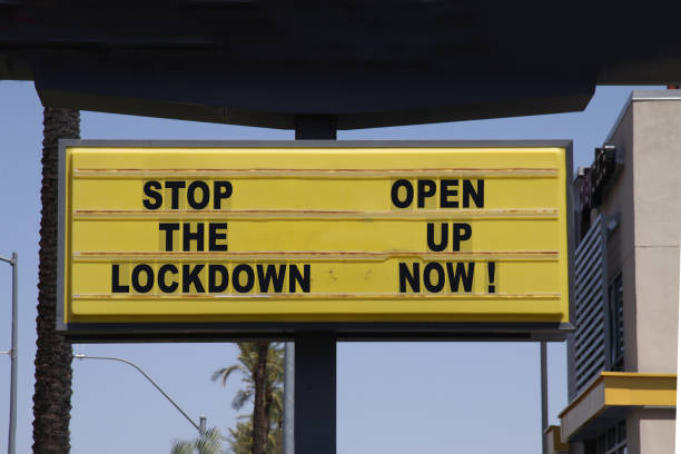 istock Billboard saying Stop the Lockdown - Open Up Now! Anti-lockdown protests. 1225767574