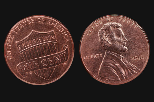 istock Old scratched american cent coin. Us currency isolated on black 1225769273