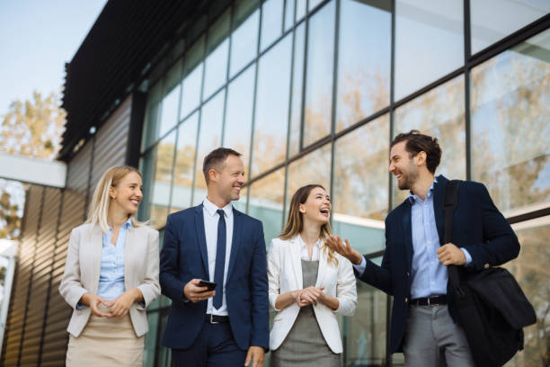istock Four young executives talking on the street 1225769738