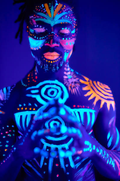 istock handsome african man with fluorescent prints on body 1225769936