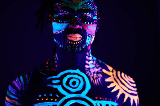 istock black man with fluorescent bodyart. studio shot 1225769991