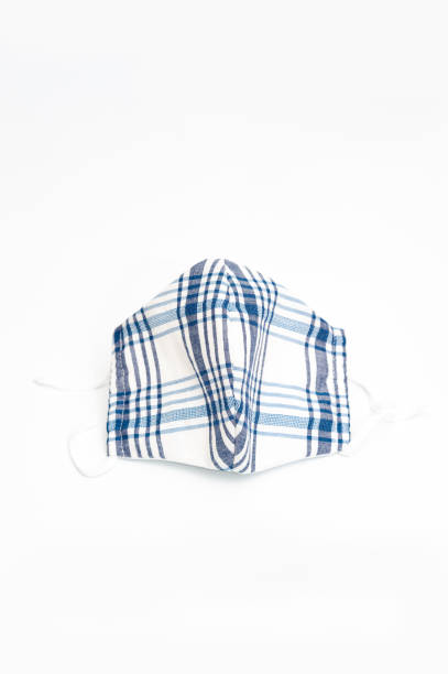 istock White and blue DIY fabric face mask for protection against coronavirus (COVID-19) and other infectious diseases. Vertical shot. 1225770768
