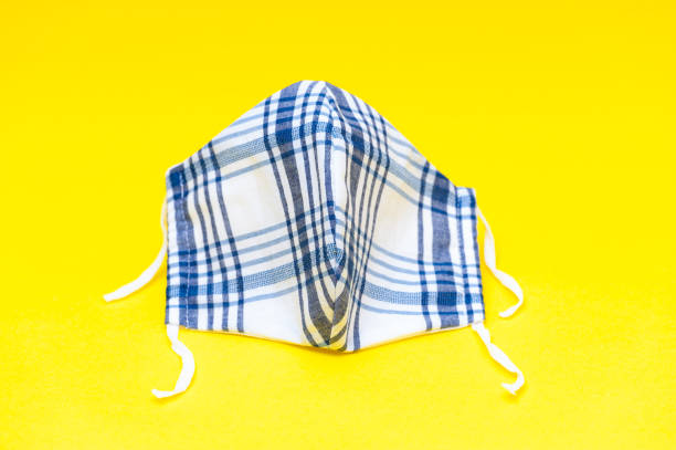 istock White and blue DIY fabric face mask for protection against coronavirus (COVID-19) and other infectious diseases. Close-up. 1225770919