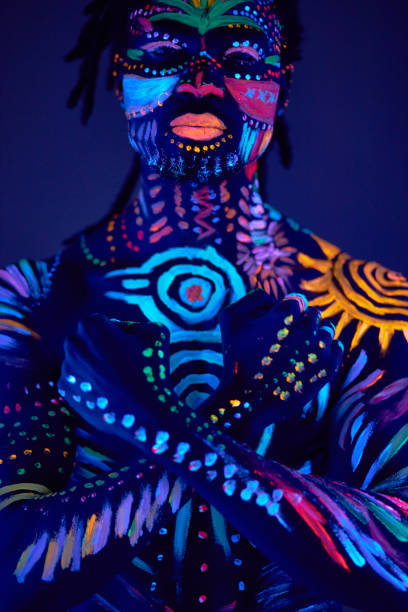 istock handsome african man with fluorescent prints on body 1225770972