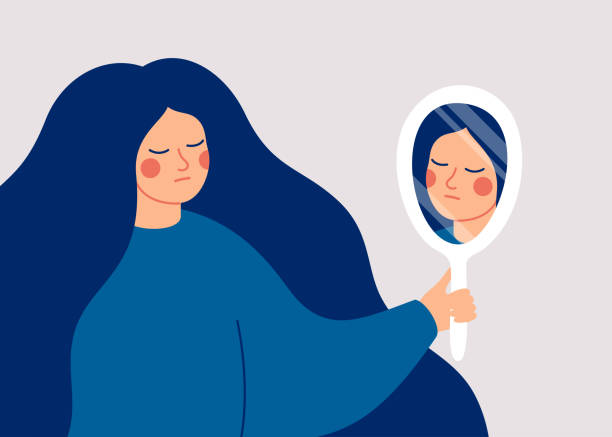 A young woman looks at her reflection in the mirror with sadness. A young woman looks at her reflection in the mirror with sadness. Body Dysmorphic Disorder concept. Vector illustration eating disorder stock illustrations